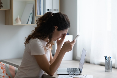 Women distressed over phone and laptop